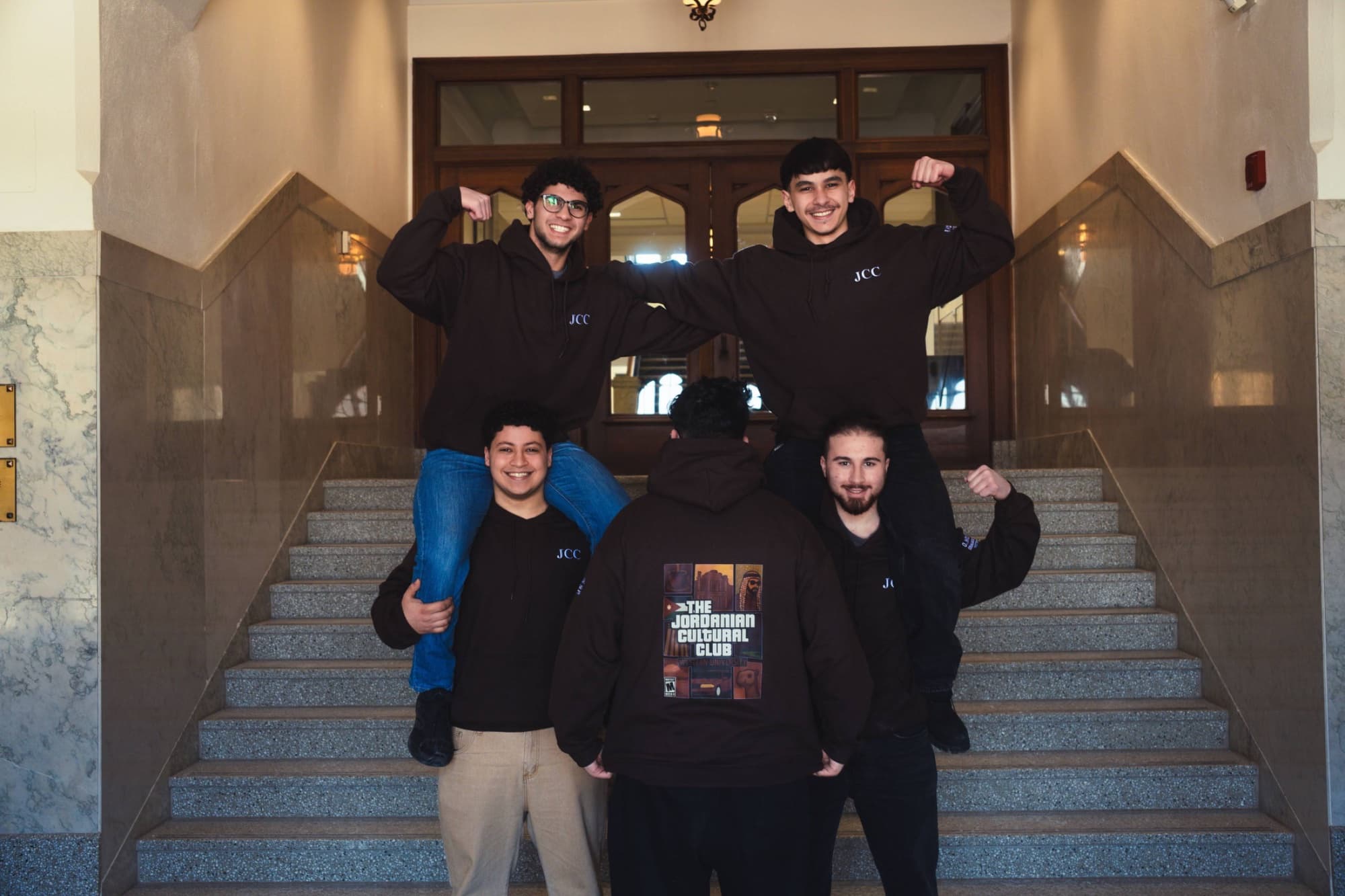 JCC members posing on stairs